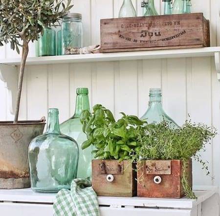 Wholesome decor with vintage glass bottles and herbs